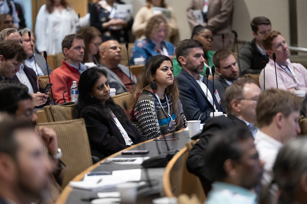 People sitting in a meeting hall at Booz Allen Hamilton