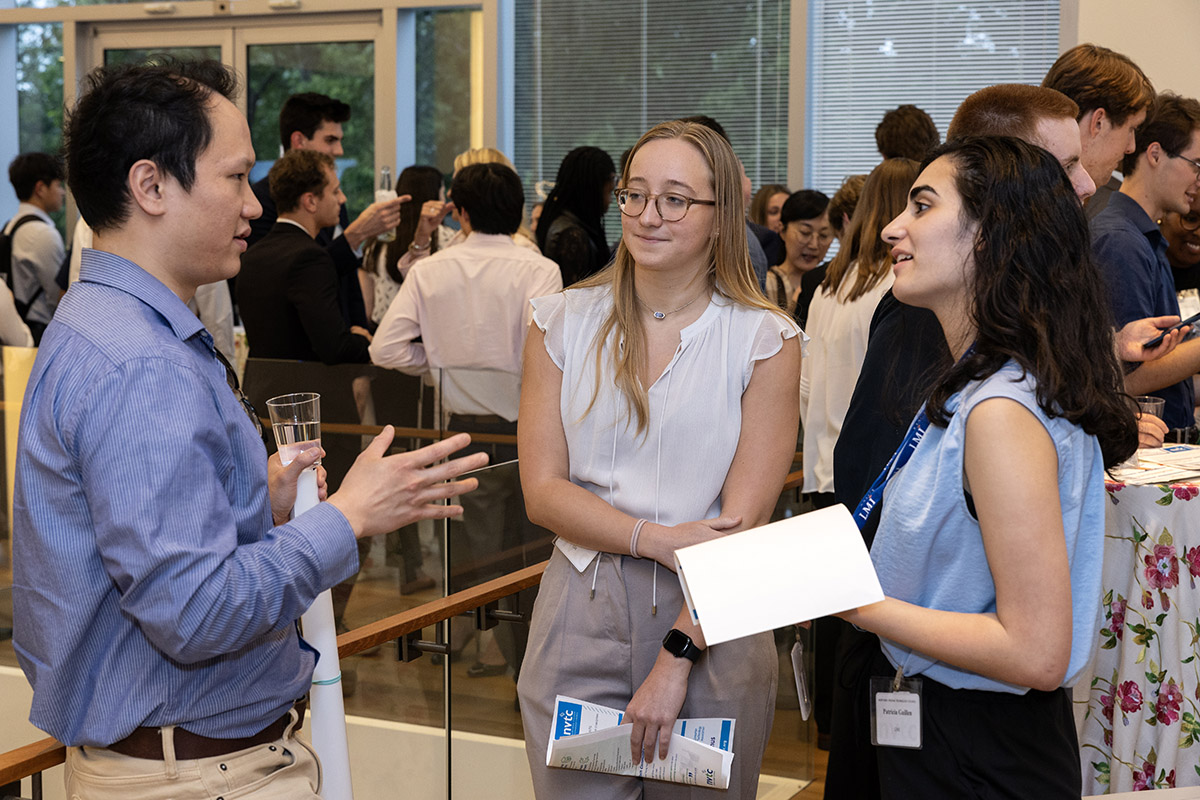 Group of people talking at an event