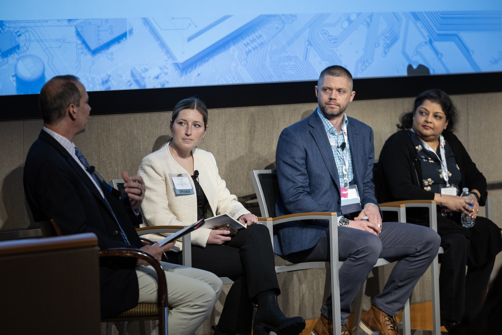 Group of panelists with a moderator at 2023's Impact AI